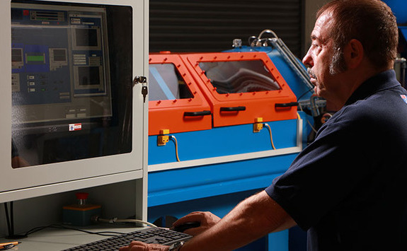 Someone on a computer in a workshop